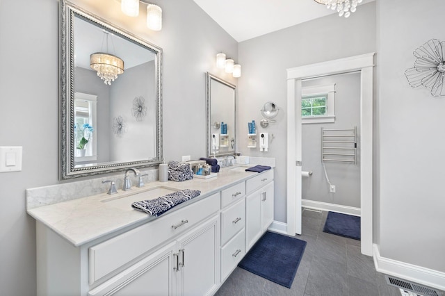 14 Finn Ln, Plainfield, CT 06374 - full bath featuring a chandelier, double vanity, and tile patterned floors