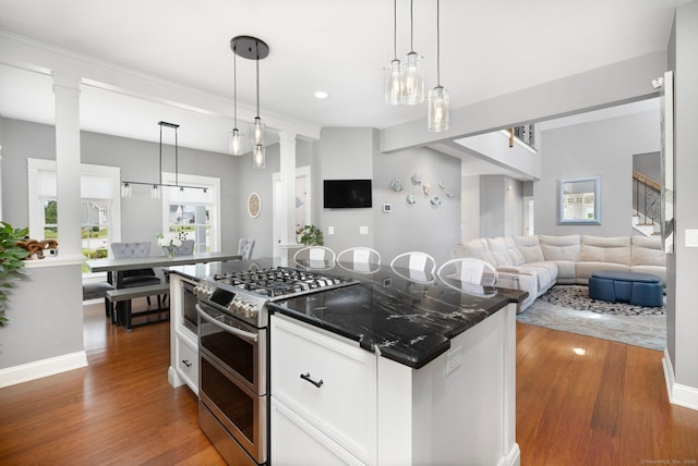 14 Finn Ln, Plainfield, CT 06374 - kitchen featuring stainless steel appliances, wood finished floors, white cabinets, open floor plan, and recessed lighting