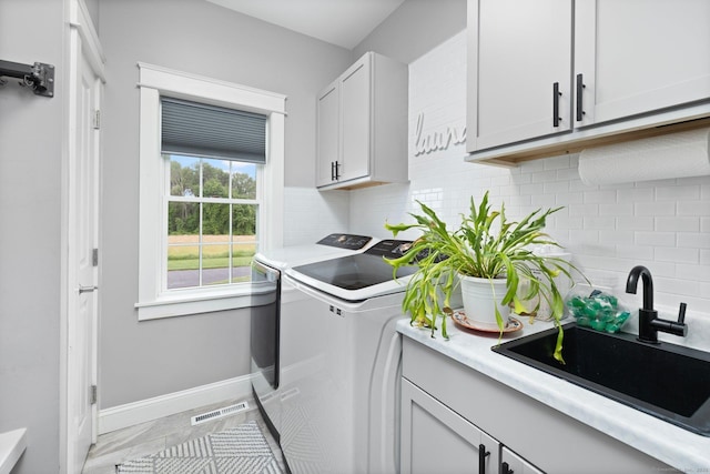 14 Finn Ln, Plainfield, CT 06374 - laundry room with washing machine and dryer and cabinet space