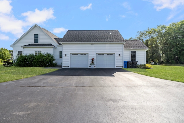 14 Finn Ln, Plainfield, CT 06374 - view of front of home with a garage, driveway, a front lawn, and roof with shingles