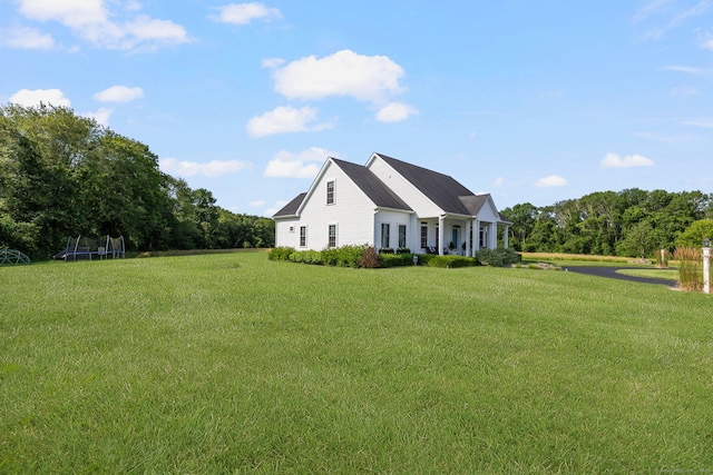 14 Finn Ln, Plainfield, CT 06374 - view of home's exterior with a trampoline and a lawn