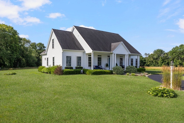 14 Finn Ln, Plainfield, CT 06374 - view of front of property featuring a front yard, a shingled roof, and covered porch