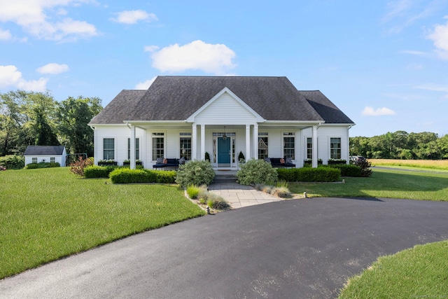 14 Finn Ln, Plainfield, CT 06374 - view of front of house with a porch, a front lawn, and an outbuilding