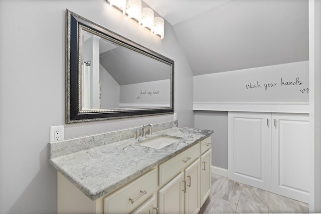 14 Finn Ln, Plainfield, CT 06374 - bathroom featuring lofted ceiling, vanity, and marble look tiles