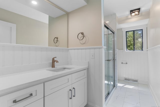 194 Bayfield Ln Unit A, Stratford, CT 06614 - full bath with a wainscoted wall, marble look tile flooring, vanity, and a shower stall