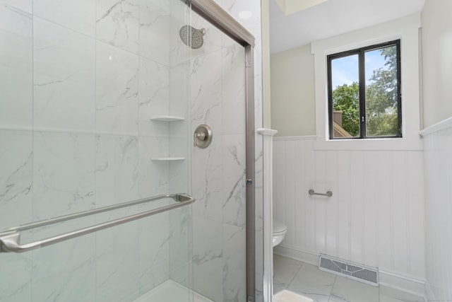 194 Bayfield Ln Unit A, Stratford, CT 06614 - bathroom featuring a marble finish shower, wainscoting, and marble look tiles