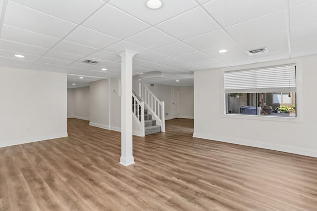 194 Bayfield Ln Unit A, Stratford, CT 06614 - below grade area with stairs, a drop ceiling, wood finished floors, and recessed lighting