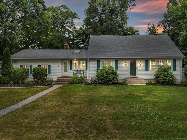 7 Lorraine Rd, Manchester, CT 06040 - view of front facade with a chimney, a front lawn, and roof with shingles