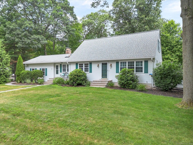 7 Lorraine Rd, Manchester, CT 06040 - view of front of house with a chimney, a front yard, and roof with shingles