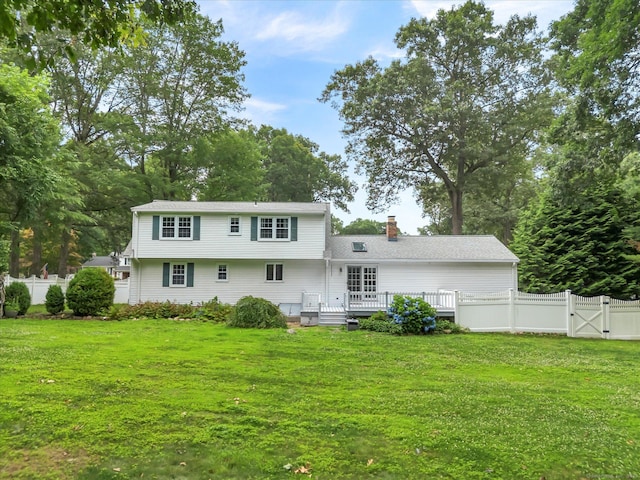 7 Lorraine Rd, Manchester, CT 06040 - rear view of property with a gate, a fenced backyard, a deck, a chimney, and view of wooded area