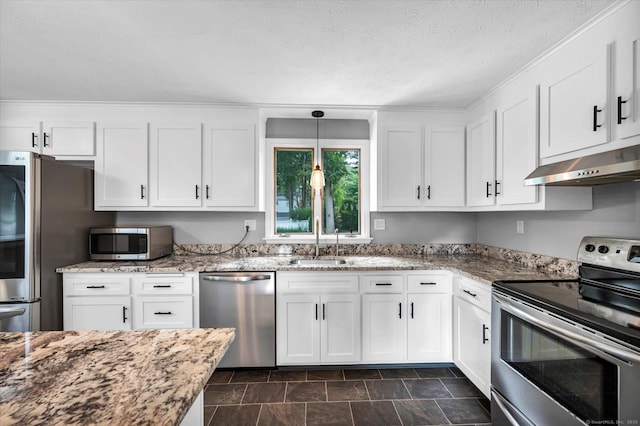 7 Lorraine Rd, Manchester, CT 06040 - kitchen featuring stainless steel appliances, under cabinet range hood, white cabinetry, light stone countertops, and pendant lighting
