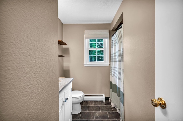 7 Lorraine Rd, Manchester, CT 06040 - bathroom featuring baseboard heating, vanity, a textured wall, a shower with curtain, and stone finish floors