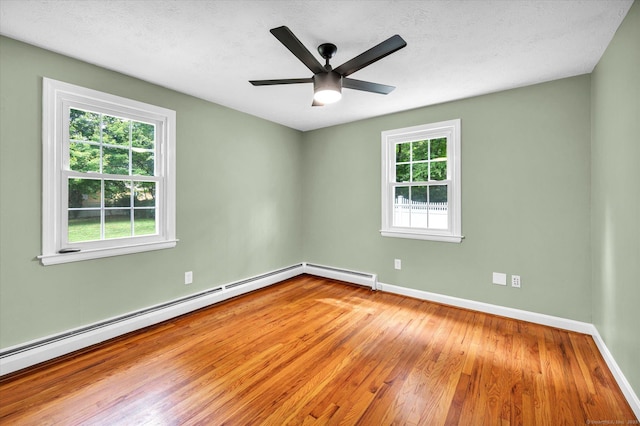 7 Lorraine Rd, Manchester, CT 06040 - empty room featuring wood finished floors, ceiling fan, baseboard heating, and a textured ceiling