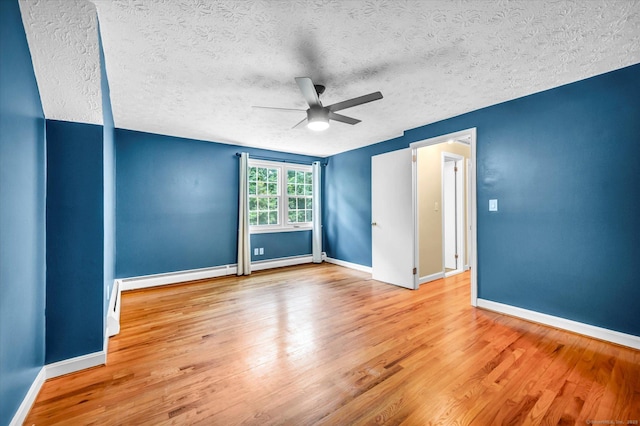 7 Lorraine Rd, Manchester, CT 06040 - spare room featuring a ceiling fan, wood finished floors, a textured ceiling, and baseboard heating