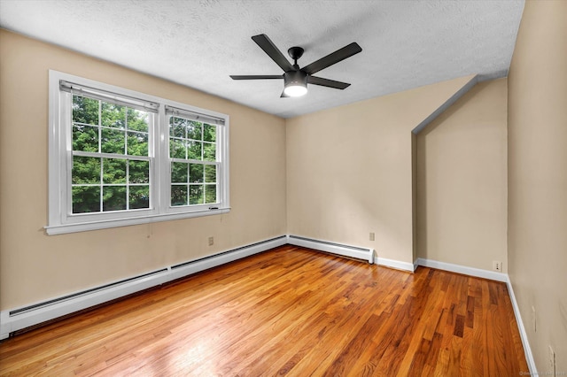 7 Lorraine Rd, Manchester, CT 06040 - empty room with a baseboard heating unit, wood finished floors, a textured ceiling, and a ceiling fan
