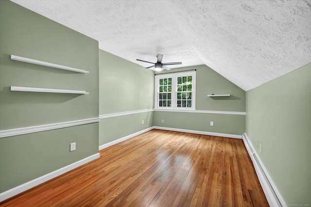7 Lorraine Rd, Manchester, CT 06040 - unfurnished room with baseboard heating, a textured ceiling, wood finished floors, lofted ceiling, and ceiling fan
