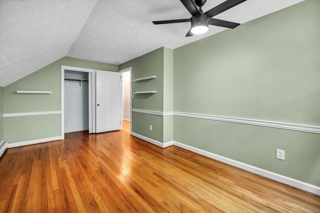 7 Lorraine Rd, Manchester, CT 06040 - unfurnished bedroom with a textured ceiling, vaulted ceiling, a closet, wood finished floors, and a ceiling fan