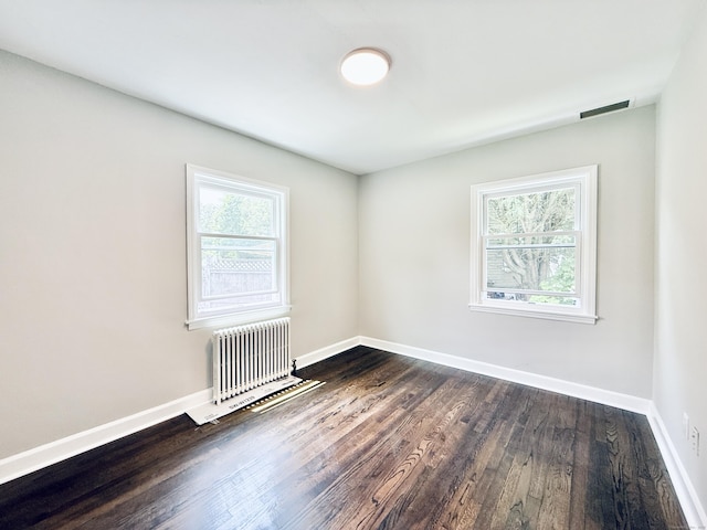 10 Meadowpark Ave W, Stamford, CT 06905 - unfurnished room featuring radiator heating unit and dark wood-type flooring