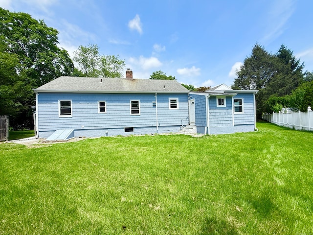 10 Meadowpark Ave W, Stamford, CT 06905 - rear view of property with a chimney