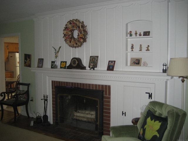 46 Wayne St, Norwich, CT 06360 - detailed view of a fireplace, freestanding refrigerator, and ornamental molding