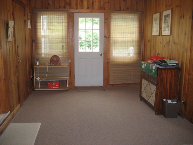 46 Wayne St, Norwich, CT 06360 - doorway with wood walls and light colored carpet