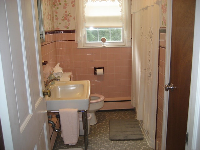 46 Wayne St, Norwich, CT 06360 - bathroom featuring a baseboard radiator, tile patterned flooring, a shower with shower curtain, a wainscoted wall, and wallpapered walls