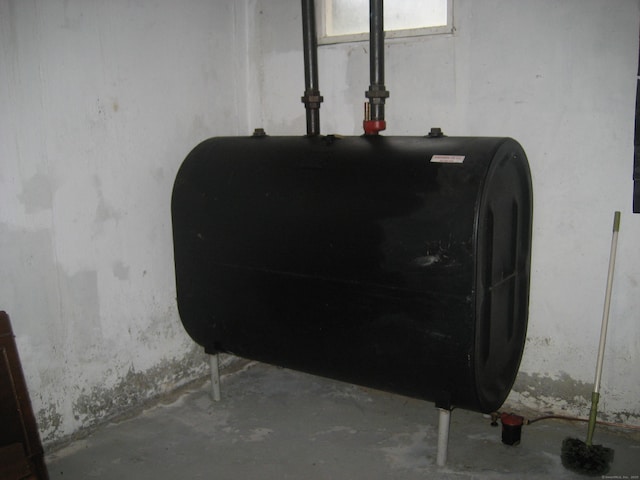 46 Wayne St, Norwich, CT 06360 - basement view of oil tank and concrete flooring