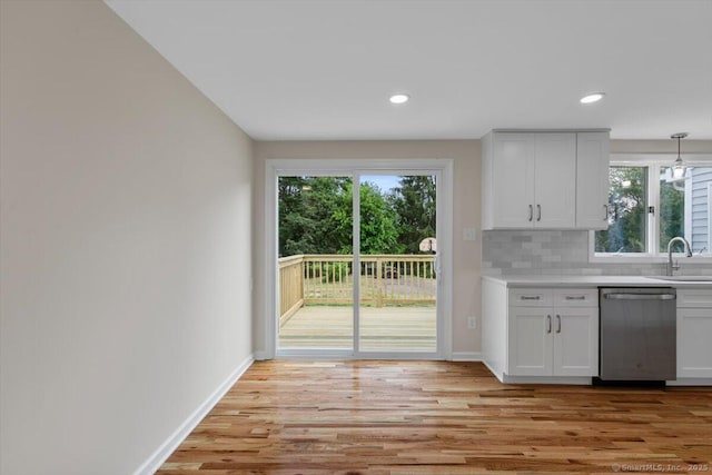 219 Browning Rd, Norwich, CT 06360 - kitchen featuring stainless steel dishwasher, healthy amount of natural light, light countertops, light wood-type flooring, and recessed lighting