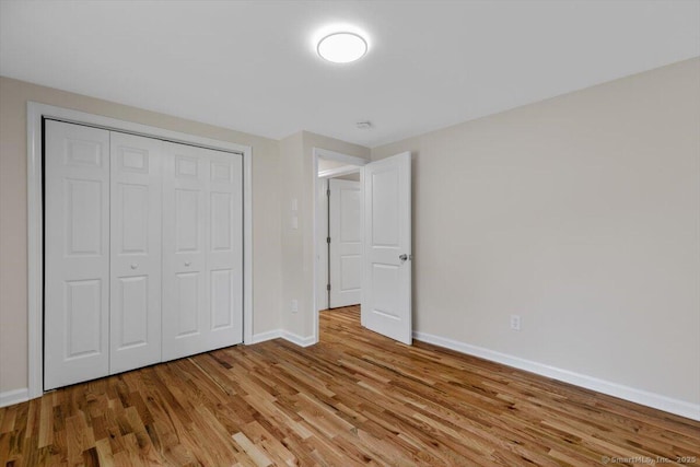 219 Browning Rd, Norwich, CT 06360 - unfurnished bedroom featuring light wood-style flooring and a closet