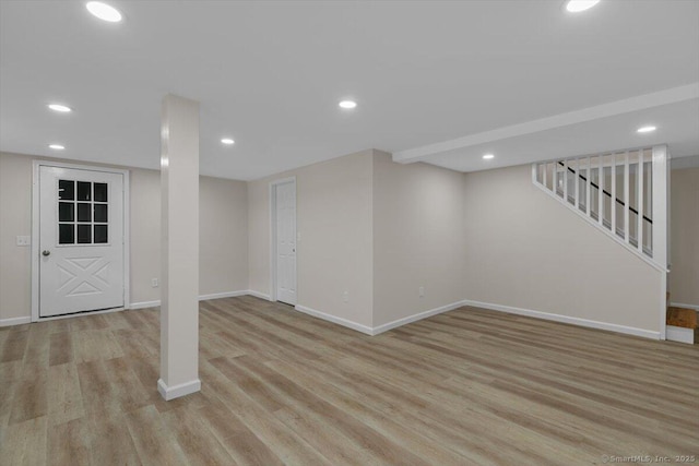 219 Browning Rd, Norwich, CT 06360 - finished basement with light wood-style flooring, recessed lighting, and stairway