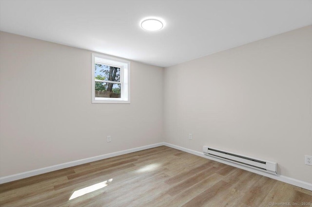 219 Browning Rd, Norwich, CT 06360 - unfurnished room with a baseboard heating unit and wood finished floors