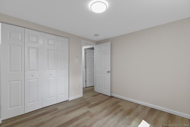 219 Browning Rd, Norwich, CT 06360 - unfurnished bedroom featuring light wood finished floors and a closet