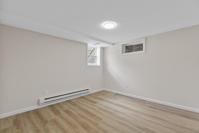 219 Browning Rd, Norwich, CT 06360 - basement with a baseboard radiator and light wood finished floors