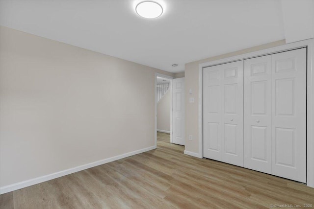 219 Browning Rd, Norwich, CT 06360 - unfurnished bedroom featuring light wood finished floors and a closet