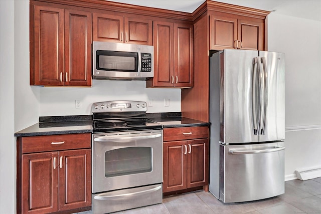 195 Whittier Rd, New Haven, CT 06515 - kitchen featuring stainless steel appliances, light tile patterned floors, and a baseboard heating unit