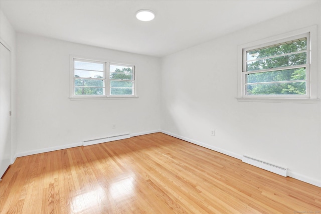 195 Whittier Rd, New Haven, CT 06515 - unfurnished bedroom with baseboard heating and wood finished floors