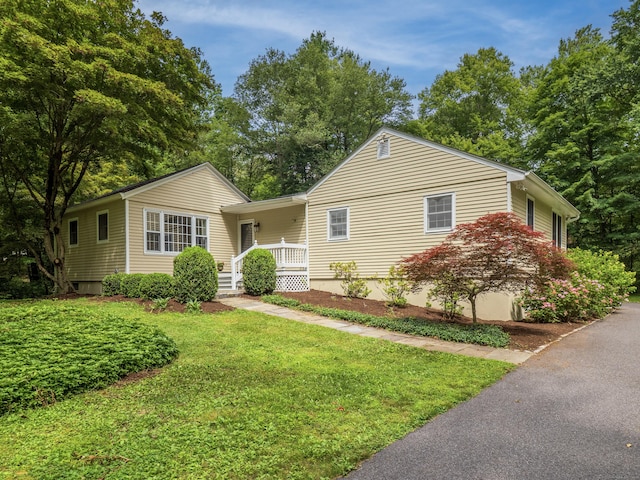 322 Mountain Rd, Wilton, CT 06897 - single story home with a front yard and a porch