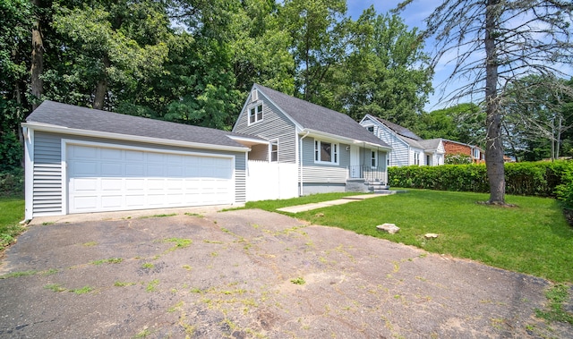 112 Pitt St, Bridgeport, CT 06606 - view of front of house with a garage, a front lawn, roof with shingles, and asphalt driveway