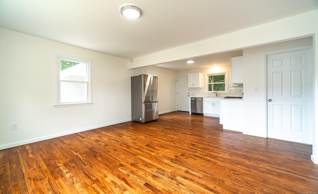 112 Pitt St, Bridgeport, CT 06606 - unfurnished living room with dark wood finished floors and baseboards