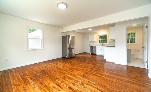 112 Pitt St, Bridgeport, CT 06606 - unfurnished living room featuring dark wood finished floors and baseboards