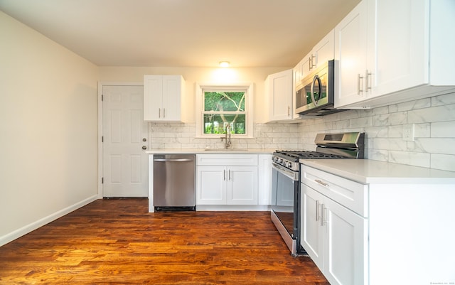112 Pitt St, Bridgeport, CT 06606 - kitchen with appliances with stainless steel finishes, decorative backsplash, light countertops, and white cabinetry