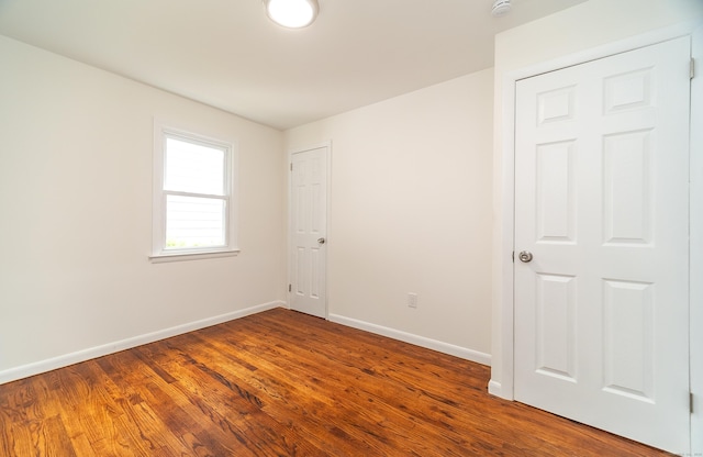 112 Pitt St, Bridgeport, CT 06606 - empty room featuring wood finished floors and a smoke detector