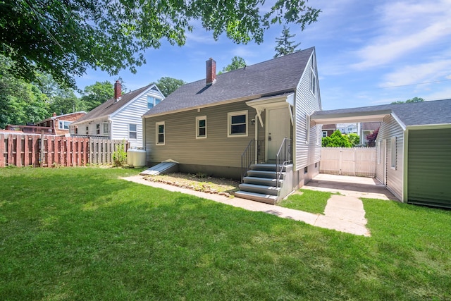 112 Pitt St, Bridgeport, CT 06606 - back of house with a chimney and roof with shingles