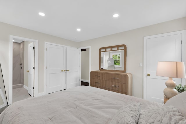 39 Cambridge Dr, Greenwich, CT 06831 - bedroom featuring recessed lighting, ensuite bathroom, and marble look tile flooring