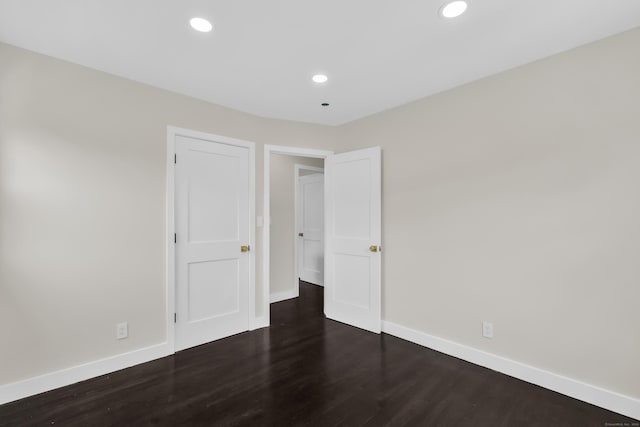 39 Cambridge Dr, Greenwich, CT 06831 - unfurnished bedroom with wood finished floors and recessed lighting
