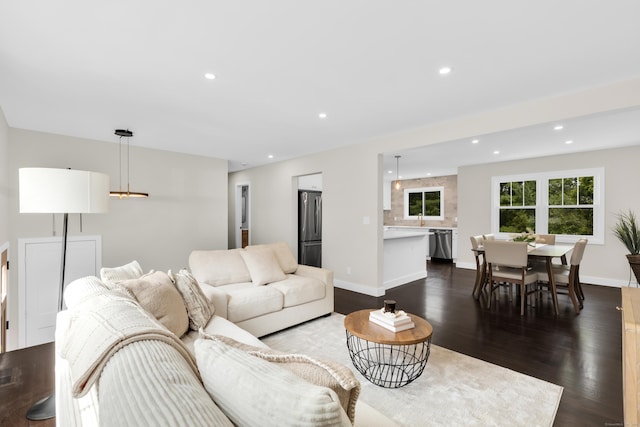 39 Cambridge Dr, Greenwich, CT 06831 - living room with dark wood-style floors and recessed lighting