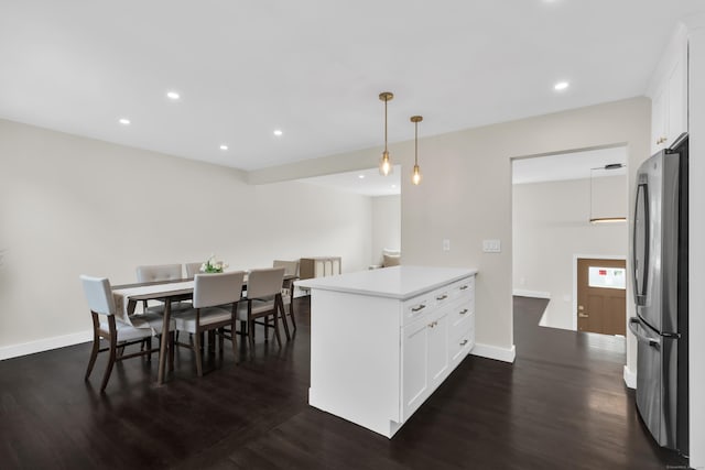 39 Cambridge Dr, Greenwich, CT 06831 - kitchen with freestanding refrigerator, a peninsula, white cabinets, dark wood finished floors, and recessed lighting