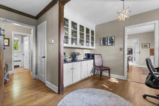 123 George St, Middletown, CT 06457 - bar area featuring radiator, wood finished floors, and crown molding
