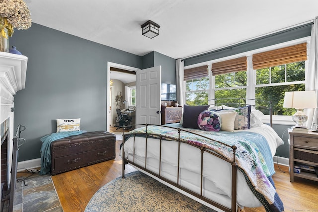 123 George St, Middletown, CT 06457 - bedroom featuring a fireplace and wood finished floors