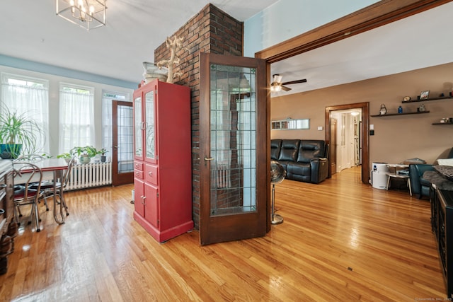135 Park Ter, Waterbury, CT 06708 - dining space with light wood-style floors, a chandelier, and ceiling fan